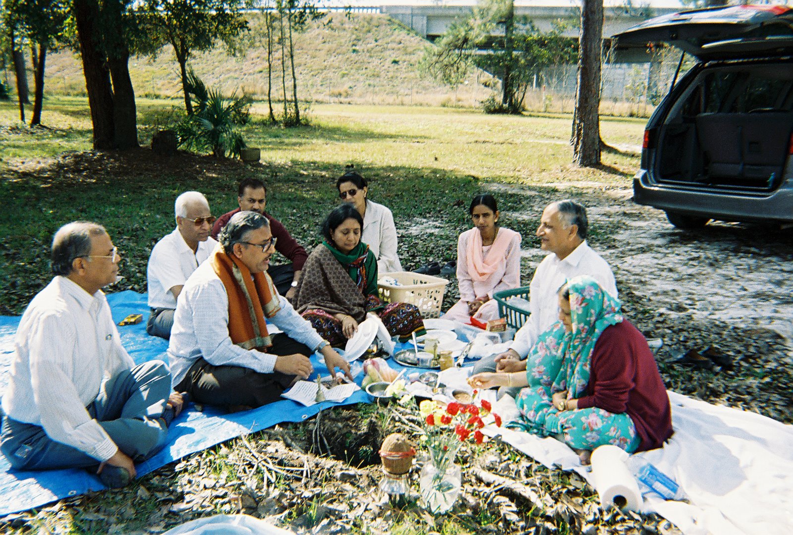 foundation members sit at groundbreaking ceremony for Hindu University of America