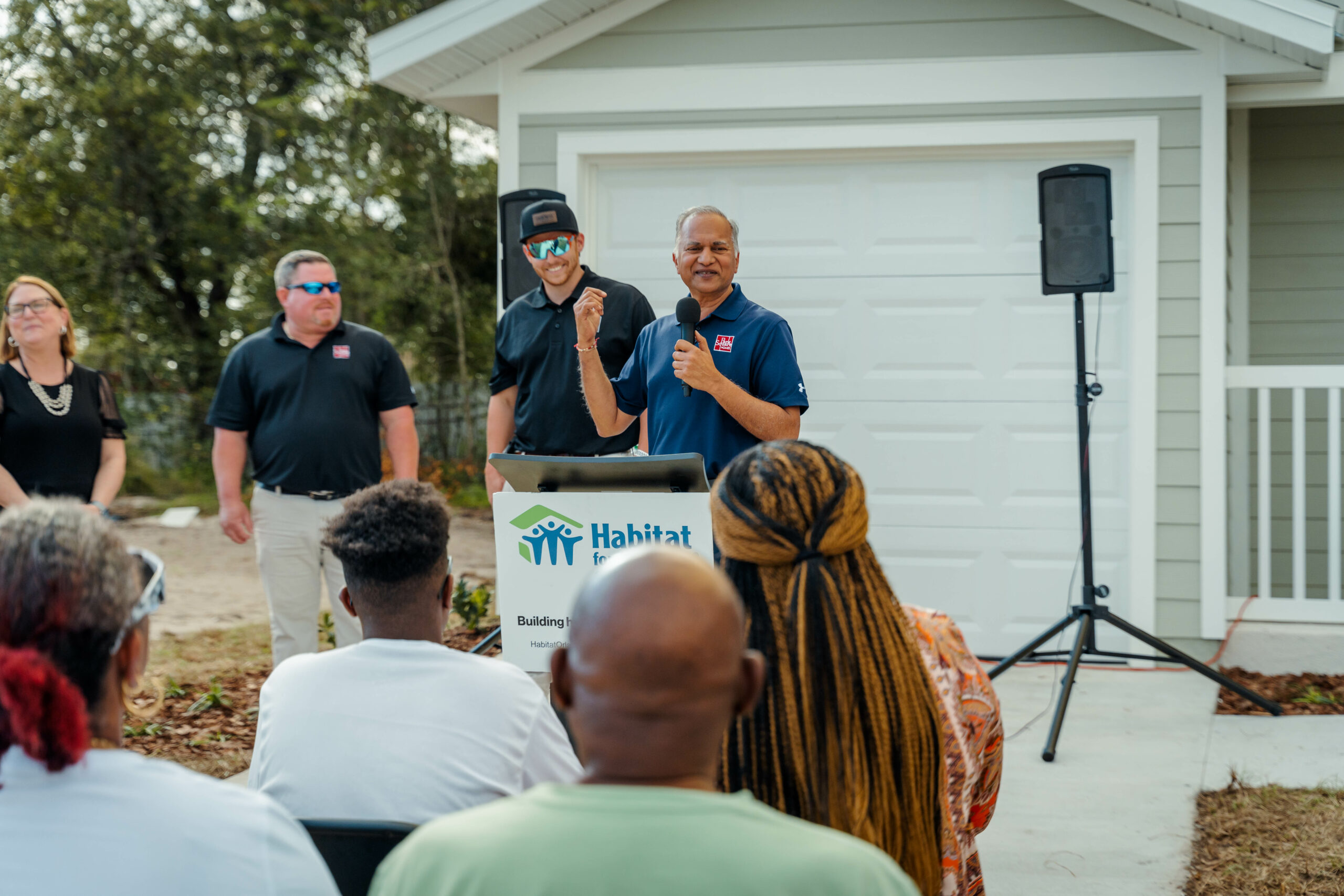 Suresh Gupta speaks in front of crowd at Habitat for Humanity Park Square Homes Blitz 2023