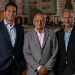 Park Square Enterprises co-CEO Vishaal Gupta; Braham Aggarwal, his grandfather; and co-CEO Suresh Gupta, his father