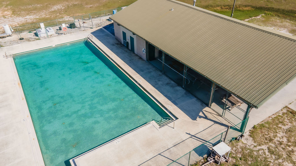 aerial view of building with outdoor pool at Pine Lake Retreat