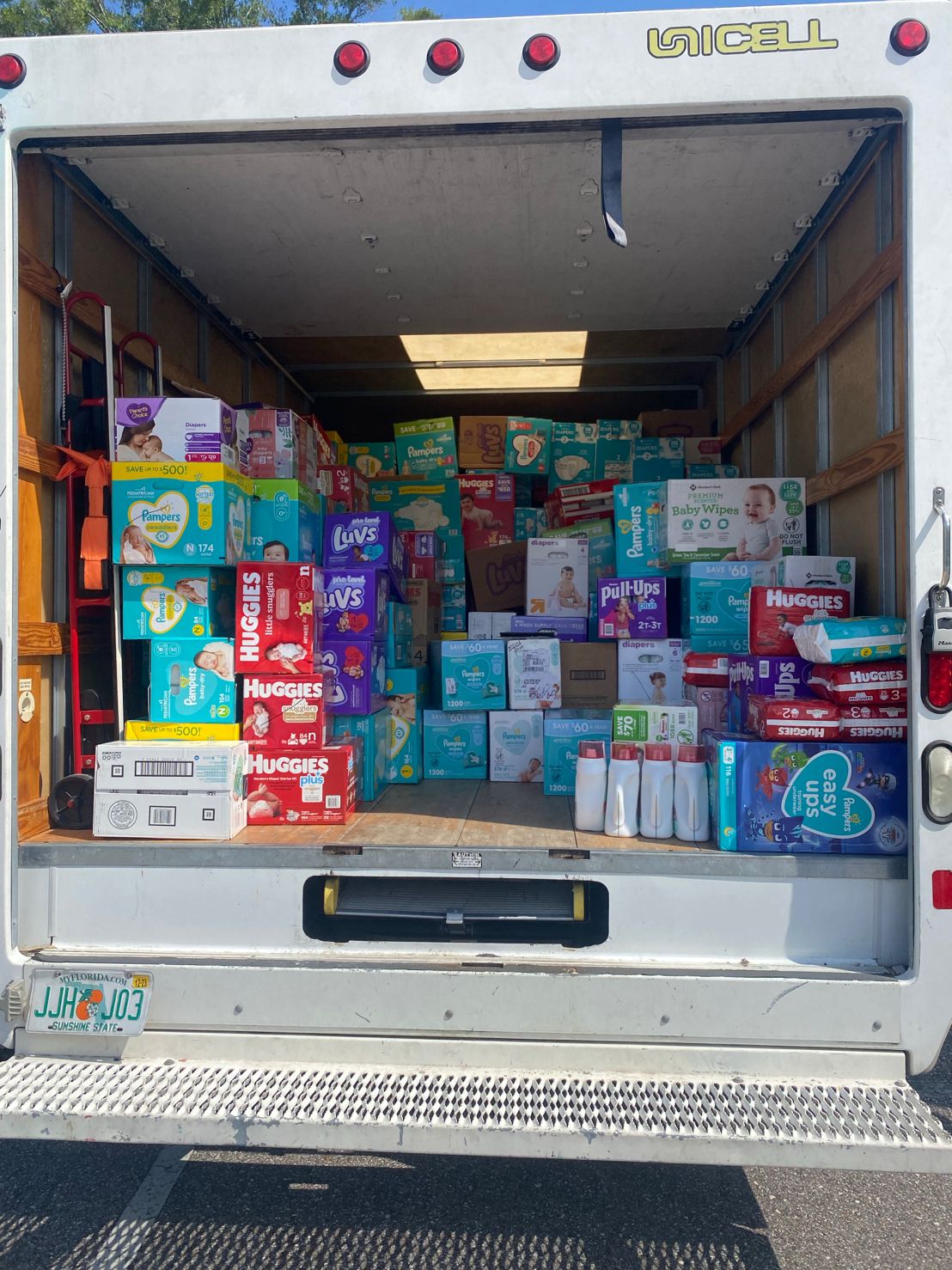 back of truck open full of new diaper boxes