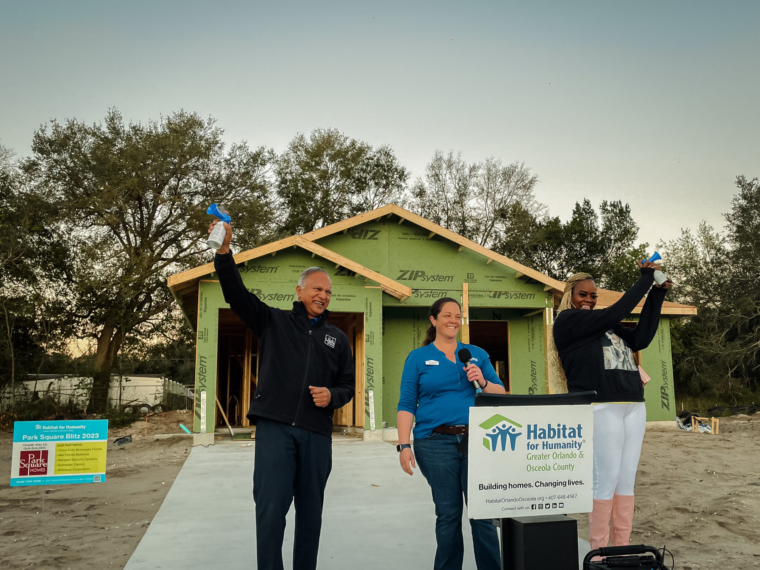 Habitat for Humanity, Park Square Homes, and new Homeowner speak in front of a home under construction during opening ceremony