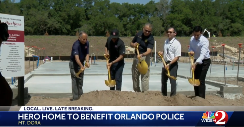 breaking ground on a new home built by Park Square Homes fr the Orlando Police Foundation